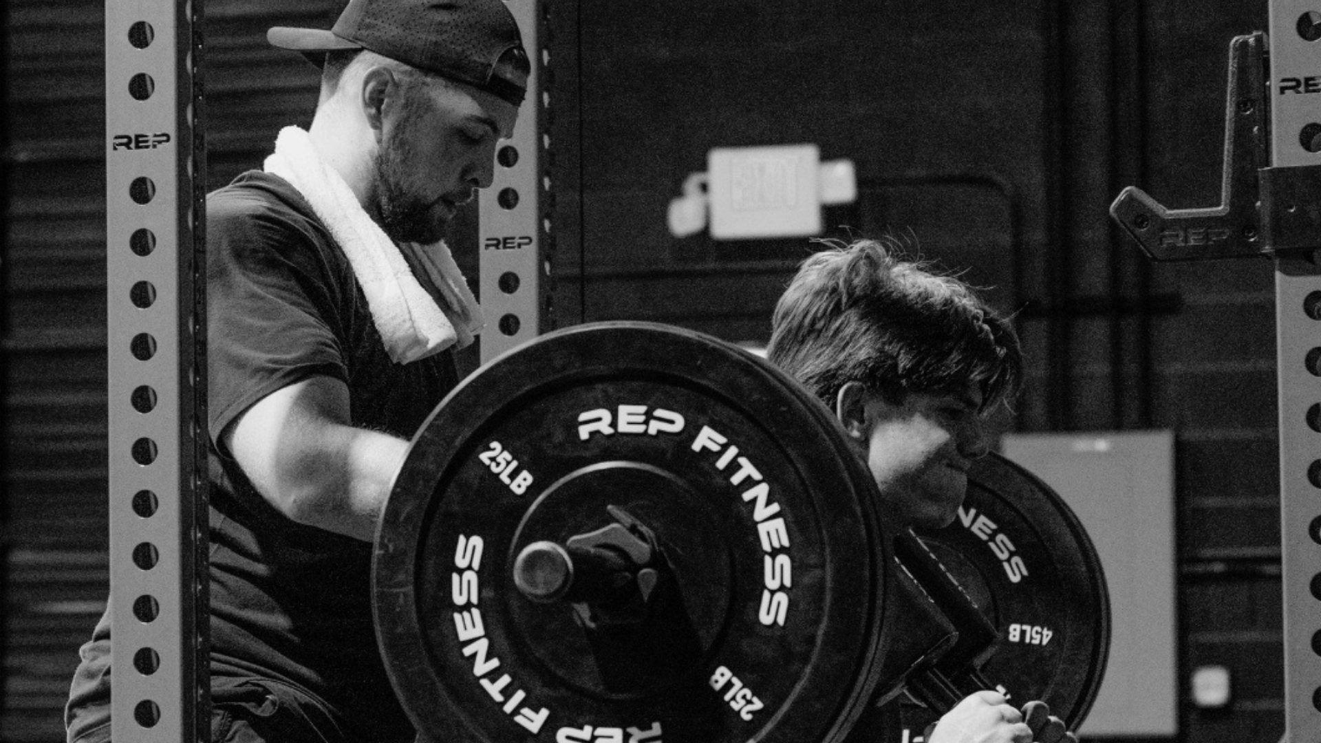 Dr. Keagan Barrett coaching a competitive athlete during strength training in North Phoenix